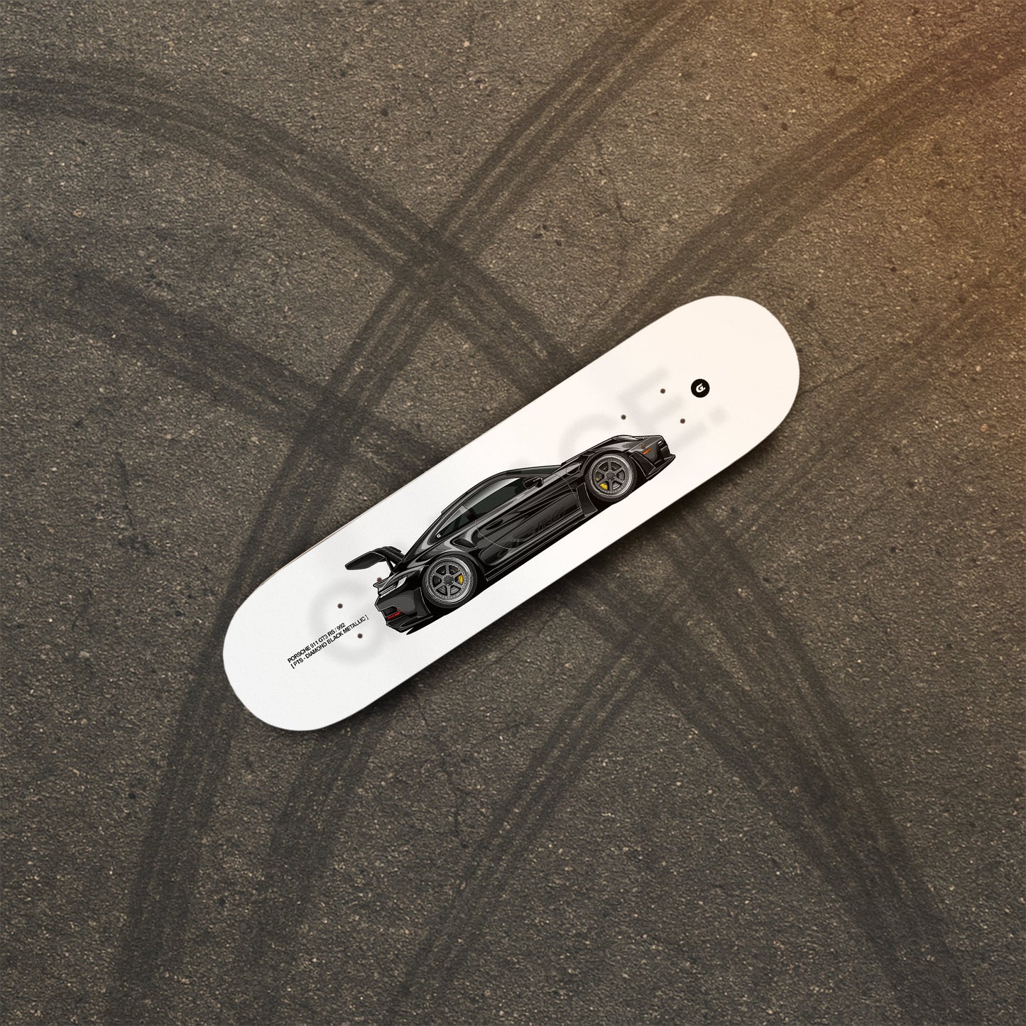 Skateboard with a car design on a textured surface