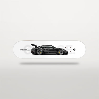 Skateboard deck with a black sports car design on a white background
